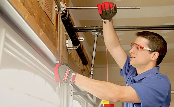Technician repairing garage door opener in Summerlin